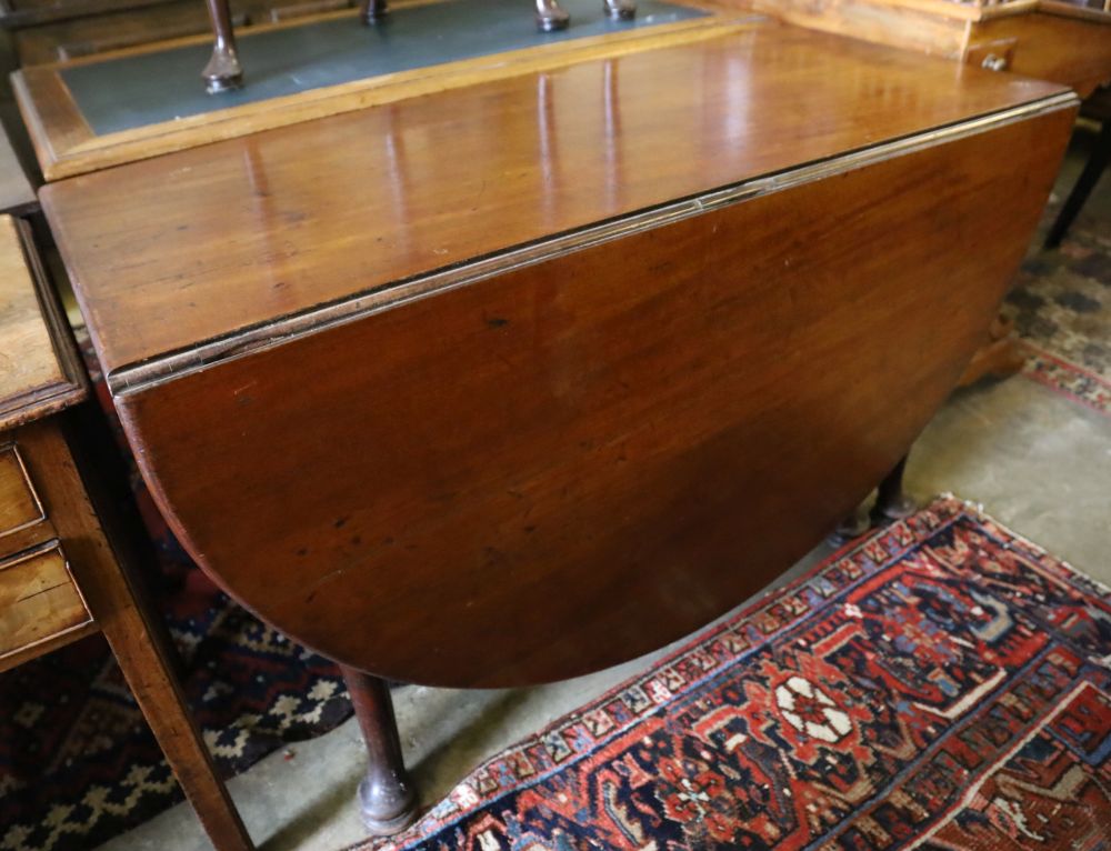 A George III mahogany pad foot oval drop leaf dining table, 170cm extended, width 120cm, height 74cm